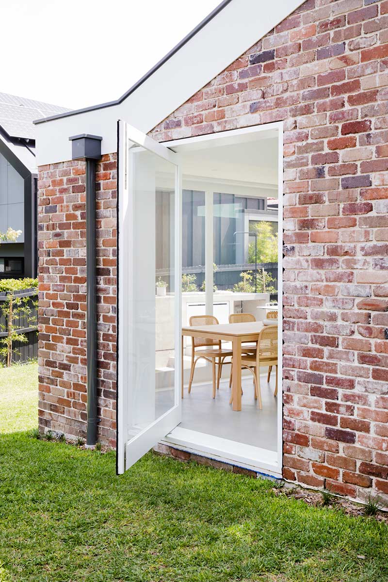 brick home extension pivot door design jl - Nat's House