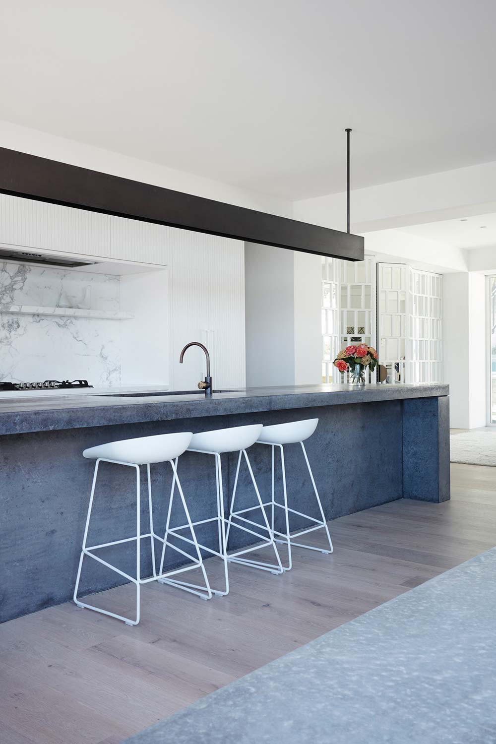 coastal home concrete kitchen island - Clovelly Residence