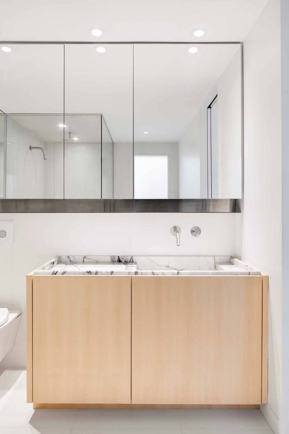 Modern bathroom in marble and wood