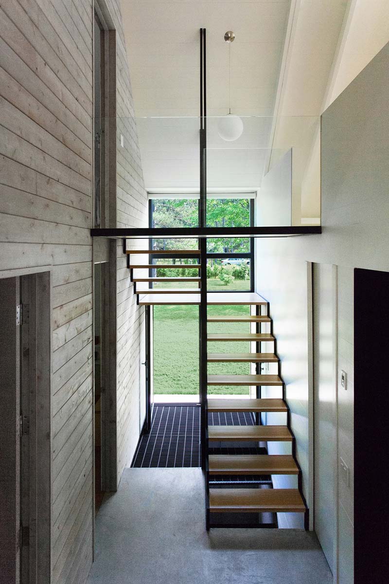 modern lake cottage staircase - Window on the Lake