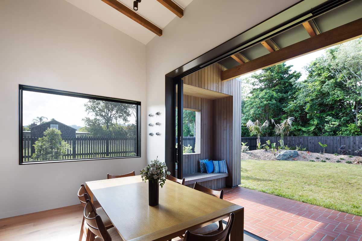 modern split level home dining - House Under Eaves