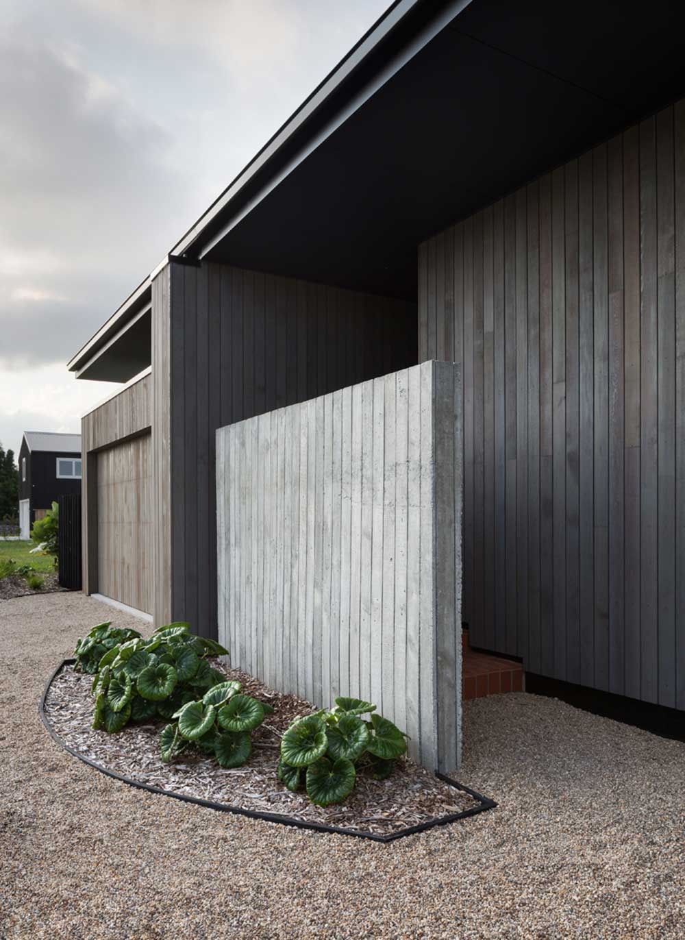 modern split level home entrance - House Under Eaves