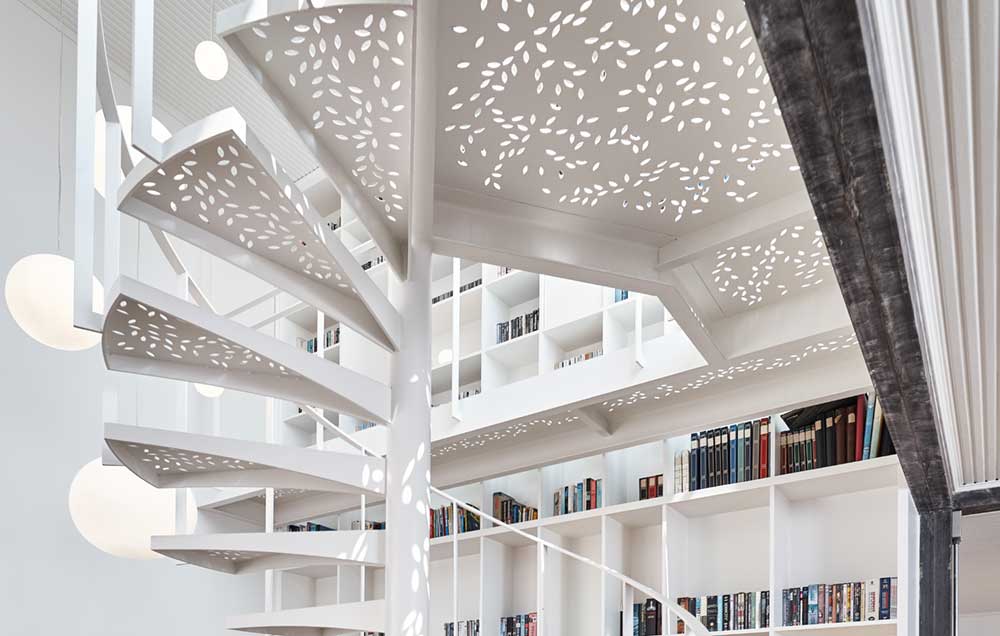 White Metal Staircase With Leaf Cutouts