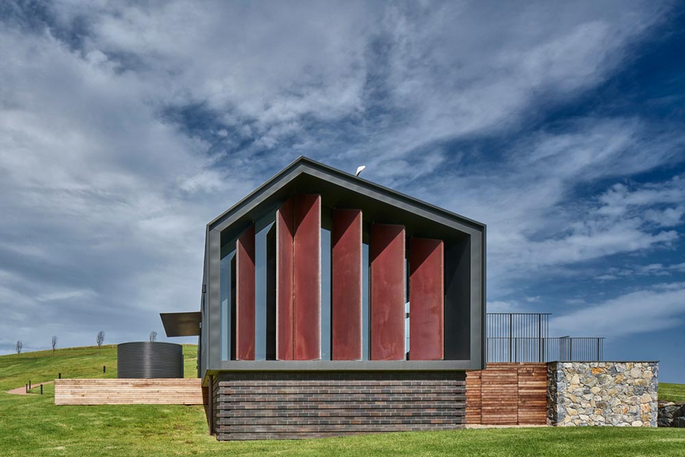 small sustainable house facade ac - Escarpment House