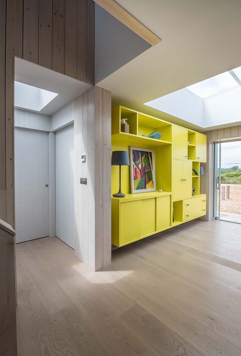 sustainable home yellow cabinet - Chalfont Beach House