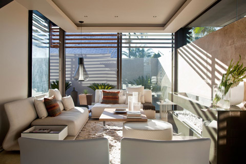 Modern Villa- Entrance hall gives access to a lounge area before arriving to a double-height social zone