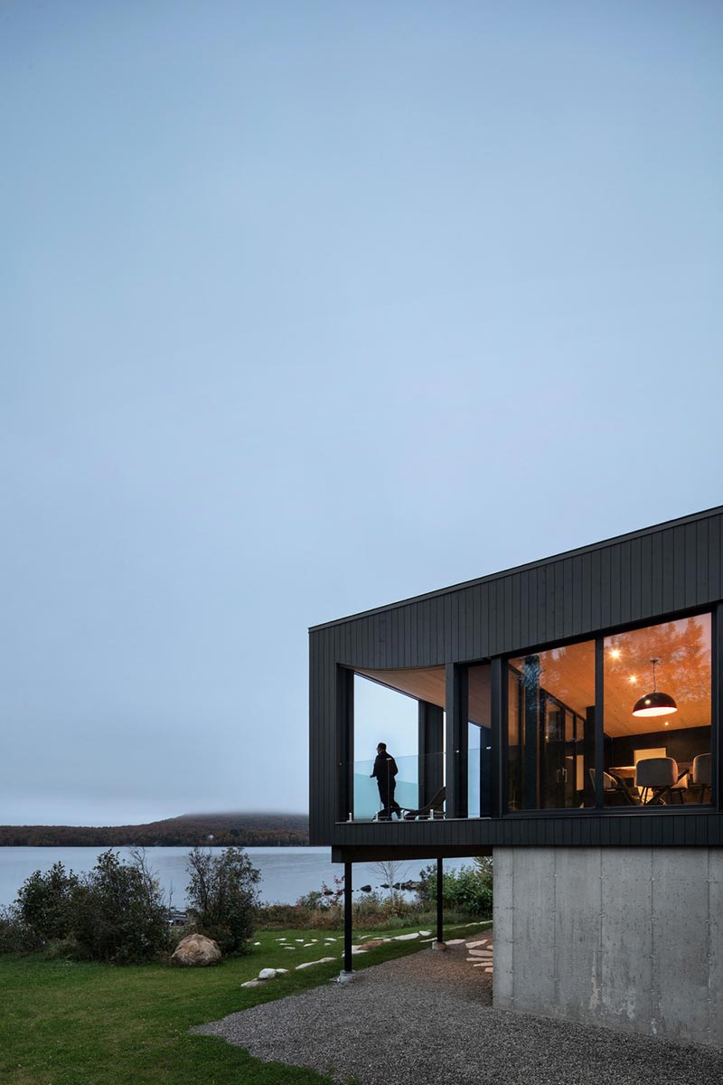 wood concrete lake house design view - La Barque Residence