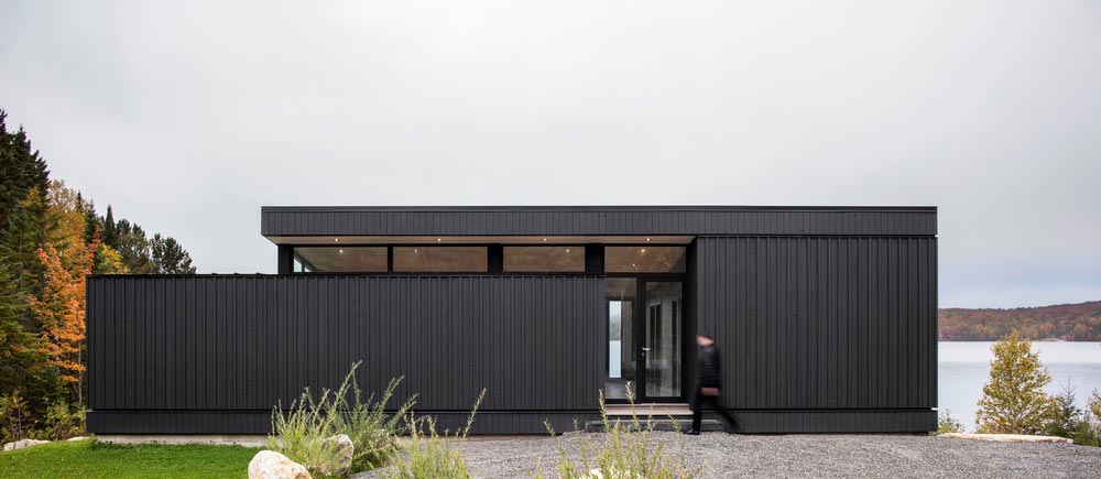 wood concrete lake house entrance design - La Barque Residence