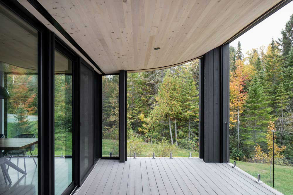 wood concrete lake house terrace design - La Barque Residence